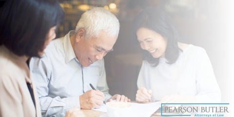 parents and child going over documents